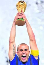 A picture taken on July 9, 2006, shows Italy's captain Fabio Cannavaro holding the 2006 World Cup trophy. Cannavaro will bring the FIFA World Cup Trophy on July 11 to the pitch of Soccer City Stadium a few moments before the beginning of the final, FIFA officials said.