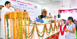 Uttarakhand Chief Minister Ramesh Pokhriyal Nishank interacts with schoolgirls at a World Population Day function in Dehradun on Sunday.