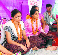 Members of the Mahila Utpidan Virodhi Sanyukt Morcha sit on hunger strike in Dehradun on Sunday