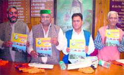MLA Jot Singh Gunsola (in green cap) at the launch ceremony of Sadhbhavna souvenir in Mussoorie 
