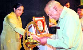 Education Minister ID Dhiman lights a lamp on the birth anniversary of Baba Kanshi Ram at the Gaiety Theatre in Shimla on Sunday.