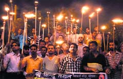 Activists of the Sri Hindu Takht take out a torchlight procession in Ludhiana. 