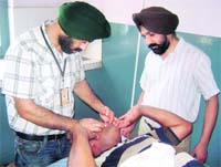 Doctors treat a snakebite victim at a hospital in Mandi Gobindgarh. 