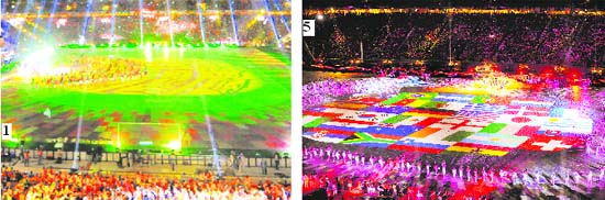 1. A view of the stands; 2. Former South African President Nelson Mandela and his wife Graca Machel wave to the crowd; 3. An unidentified man being restrained by security staff after he tried to place a hat on the World Cup trophy; 4. Colombian singer Shakira performs; 5. Musicians and singers perform during the closing ceremony before the 2010 World Cup final soccer match between the Netherlands and Spain at Soccer City in Johannesburg on Sunday.
