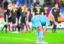 Uruguays Diego Godin reacts after Germany's Sami Khedira scored the winner at the Nelson Mandela Bay stadium in Port Elizabeth on Saturday.