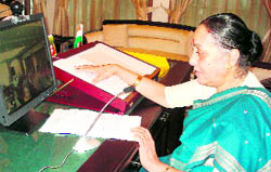 Governor Margaret Alva addresses a conclave of Vice-Chancellors of open universities, being held near Nainital, through video conferencing in Dehradun on Monday