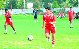 SSP of Haridwar Sanjay Gunjiyal moves ahead with the ball at an exhibition match at the BHEL stadium in Haridwar 