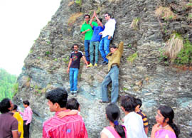 Tourists getting themselves photographed at a hill near Nainital