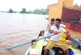 A priest at a temple near Narkatari village calls for help