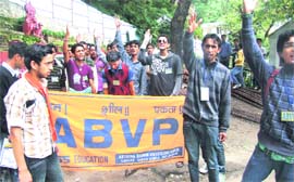 Activists of the ABVP shout slogans at Chaura Maidan College in Shimla on Monday.
