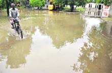 A road in front of residences of administrative officials flooded due to the heavy rain.