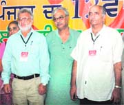 National general secretary of CITU Tapan Sen flanked by Vijay Mishra (left) and Raghu Nath Singh, who have been chosen as president and general secretary of the Punjab unit of CITU, respectively, in Bathinda on Monday.
