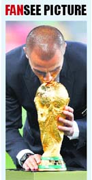 Italys Fabio Cannavaro kisses the World Cup trophy before the final between Netherlands and Spain in Johannesburg on Sunday. Italy had won the 2006 edition