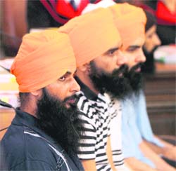 Defendants wait for the start of their trial at Vienna's main court on Monday.