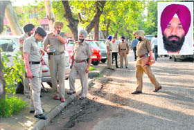 Policemen inspect the spot where Youth Akali leader Triptdeep Singh Sekhon (inset) was found injured in Sector 9, Chandigarh, on Tuesday.