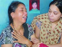 Mother and sister of Kamal Singh Rawat (inset) mourn his death at their residence in north Delhi
