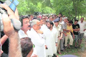 Chief Minister Bhupinder Singh Hooda at the flood-hit Nejadela Kalan village in Sirsa