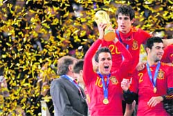 Cesc Fabregas celebrates with the FIFA World Cup trophy. 