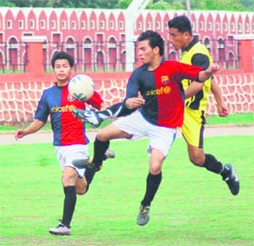 Players in action during a match of the District Football League in Dehradun on Wednesday. 