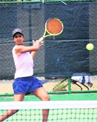 Sharmada Balu plays a forehand during a match of the HTA-AITA Mens and Womens Tournament-2010 at Jagraon