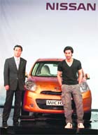 Actor Ranbir Kapoor with Kiminobu Tokuyama, MD and CEO of Nissan Motor India, pose with Micra at its launch in New Delhi on Wednesday.