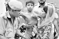 Police officials hand over Juveer to his mother at the Mauli Jagran police post in Chandigarh on Thursday