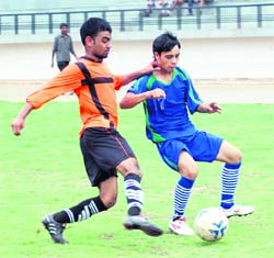 A match in the Dehradun Football League being played at the Police Lines ground in Dehradun on Thursday. 