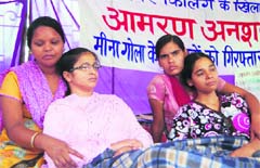 Two girls continue a fast demanding a fair probe into the killing of Meena Gola at the Gandhi Park in Dehradun on Thursday