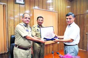 DGP Subhash Joshi (centre) being presented a memento at a farewell function in Dehradun on Thursday. He is going to the CRPF as Special DGP. Joshi had joined 