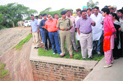 Union Minister Kumari Selja talks to people in the flood-hit areas in Ambala. 