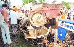 The mangled remains of the tractor that collided with a train on Thursday