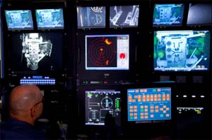 BP pilots work in the ROV (remotely operated vehicles) control station onboard Discoverer Inspiration in the Gulf of Mexico in this picture taken on July 12, 2010. BP Plc is testing a new cap on its runaway well in an effort to arrest the flow of oil gushing into the Gulf of Mexico for the last 12 weeks. 