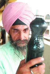 Jagdish Singh show the contaminated water being supplied through government water supply lines in Ward 25 in Amritsar.