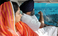 Deputy CM Sukhbir Singh Badal along with his wife and MP Harsimrat Kaur Badal conducting an aerial survey of the flood-hit areas of Sardulgarh in Mansa district