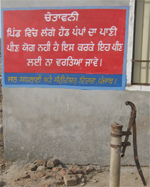 Warning pasted on a wall in village Teja Rawela asking people not to use water from the handpumps. 