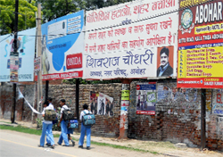 A hoarding of the Municipal Council stands tall at one of the accident-prone crossings in Abohar.