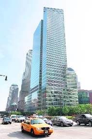 Vehicles pass by Goldman Sachs Groups headquarters in New York on Thursday. Goldman Sachs has agreed to pay $550 million to settle civil fraud charges over how it marketed a subprime mortgage product, ending months of negotiations that rattled the bank's clients and investors.