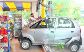 A Tata Nano that entered a showroom of Bharat Petroleum in Sector 21, Chandigarh, on Friday.