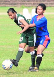 A forward player of Assam tries to score a goal against Uttarakhand during the 9th Junior National Girls Under-19 Football Championship at Sector 12, Chandigarh, on Friday.