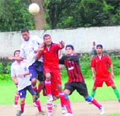A match in progress at the Lala Nemi Dass District Football League in Dehradun on Friday. 