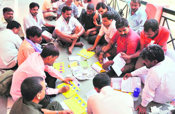 Yatris fill up forms for registration for Amarnath yatra in Jammu.