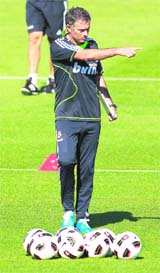 Real Madrids new coach Jose Mourinho, who calls himself the Special One, gives instructions to players during Real Madrid's training session in Madrid on Friday
