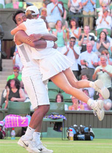 Leander Paes (L) and Cara Black of Zimbabwe celebrate after winning the mixed doubles final at the Wimbledon Tennis Championships in London recently