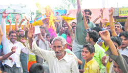 Residents of Sarai village burn an effigy of the municipality in Haridwar