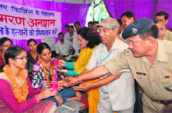 Jyoti and Rajni being offered juice to end their stir in Dehradun