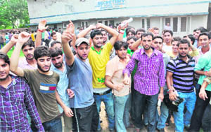 Alleging the paper was out of syllabus, students of Government Polytechnic College protest against the state Board of Technical Education in Jammu on Saturday. 