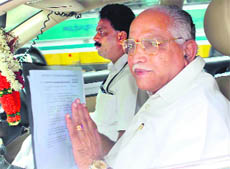 Karnataka Chief Minister BS Yedyurappa comes out after meeting BJP leader LK Advani at his residence in New Delhi on Saturday.