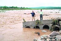 A temporary bridge linking Punjab and Himachal Pradesh, near Pathankot, which has been washed away