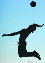 A silhouette of a volleyball player is seen during the AVP Hermosa Beach Open at the Hermosa Beach Pier in California on Friday.