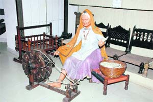 A scene from Haryanavi life is sculpted in this model with the charkha